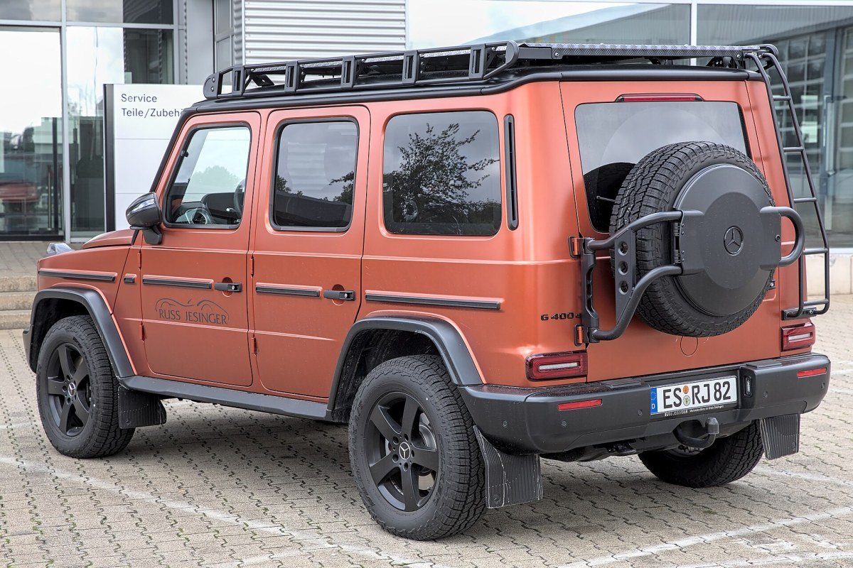 A boxy Mercedes-Benz G-Class off-road vehicle with round headlights.