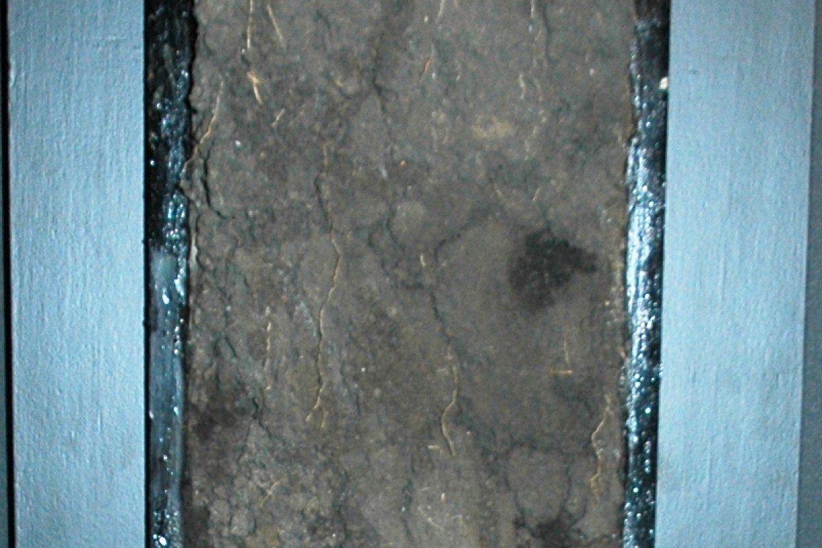 A soil profile showing a thick dark layer of chernozem above lighter subsoil.