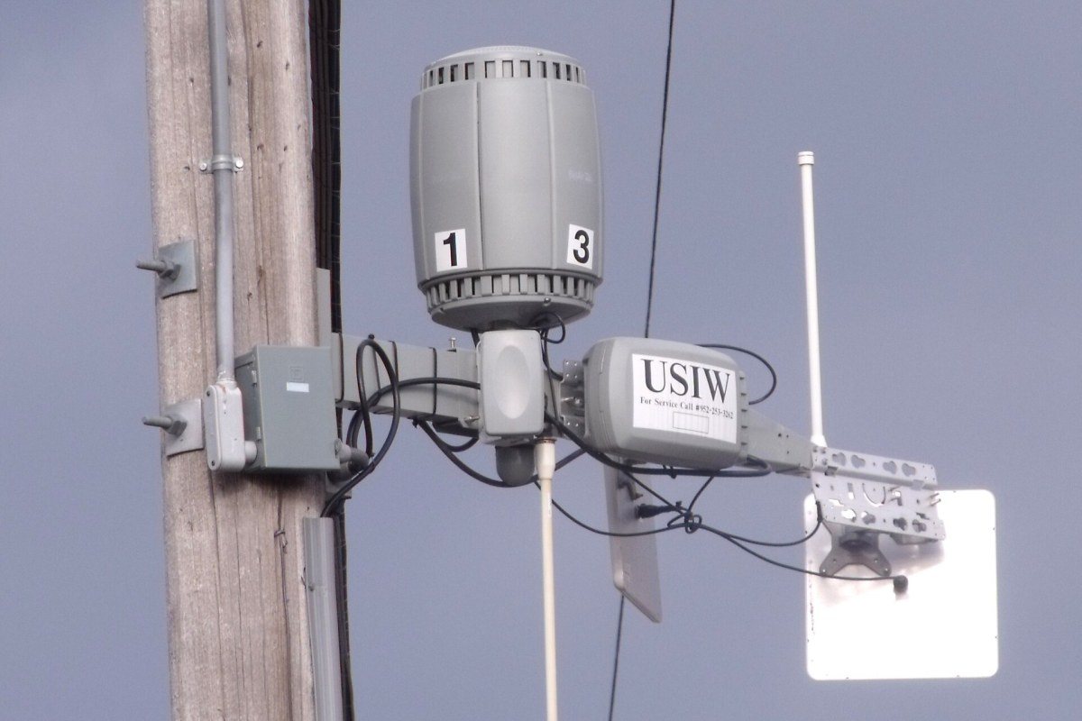 A home wireless router with several external antennas.