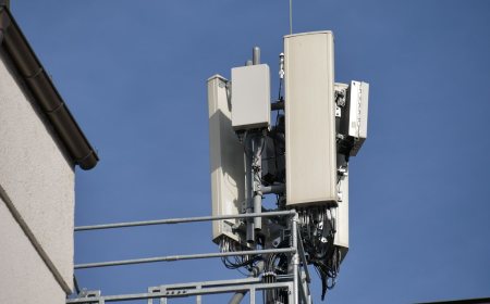 A mobile network antenna installation used for 5G service mounted on a mast.